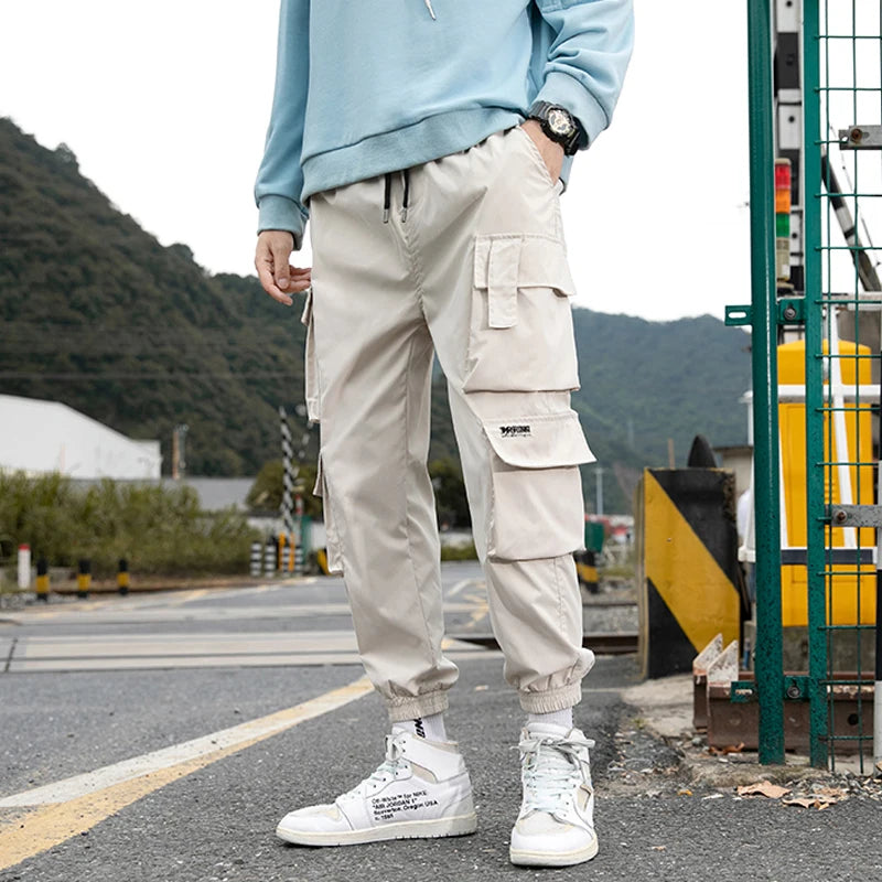 KK BRAND – Men’s Tapered Utility Trousers Effortless street style meets everyday comfort STYLE OF COLOR Black, Khaki, Light Grey, and Light Blue IN 2025