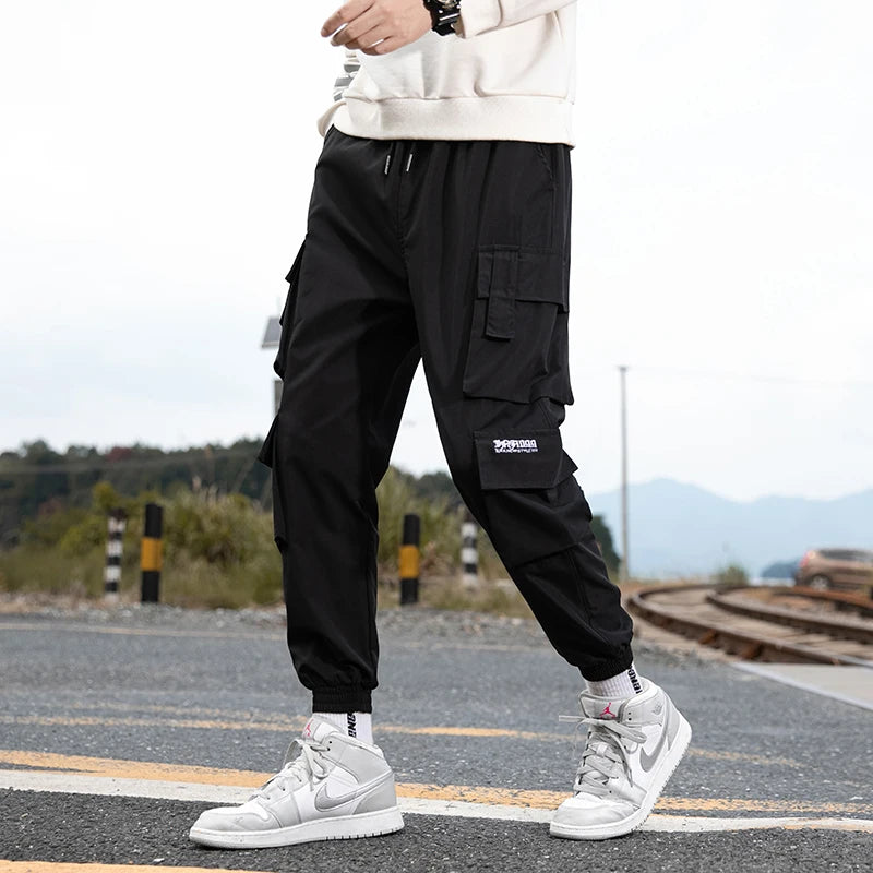 KK BRAND – Men’s Tapered Utility Trousers Effortless street style meets everyday comfort STYLE OF COLOR Black, Khaki, Light Grey, and Light Blue IN 2025